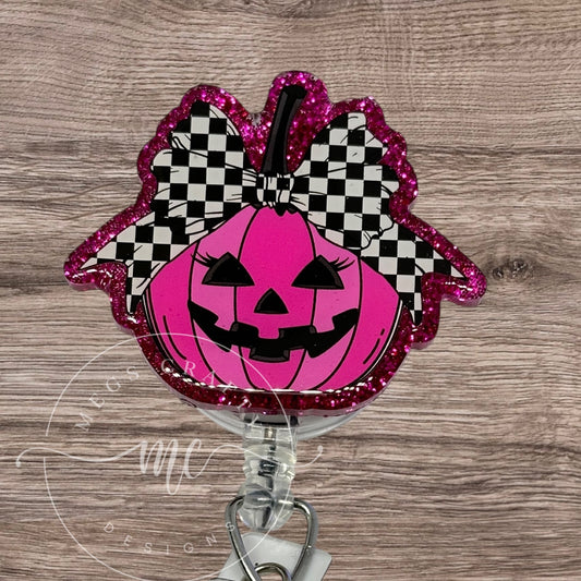 Pink Pumpkin jackolantern with checkered bow Badge Topper